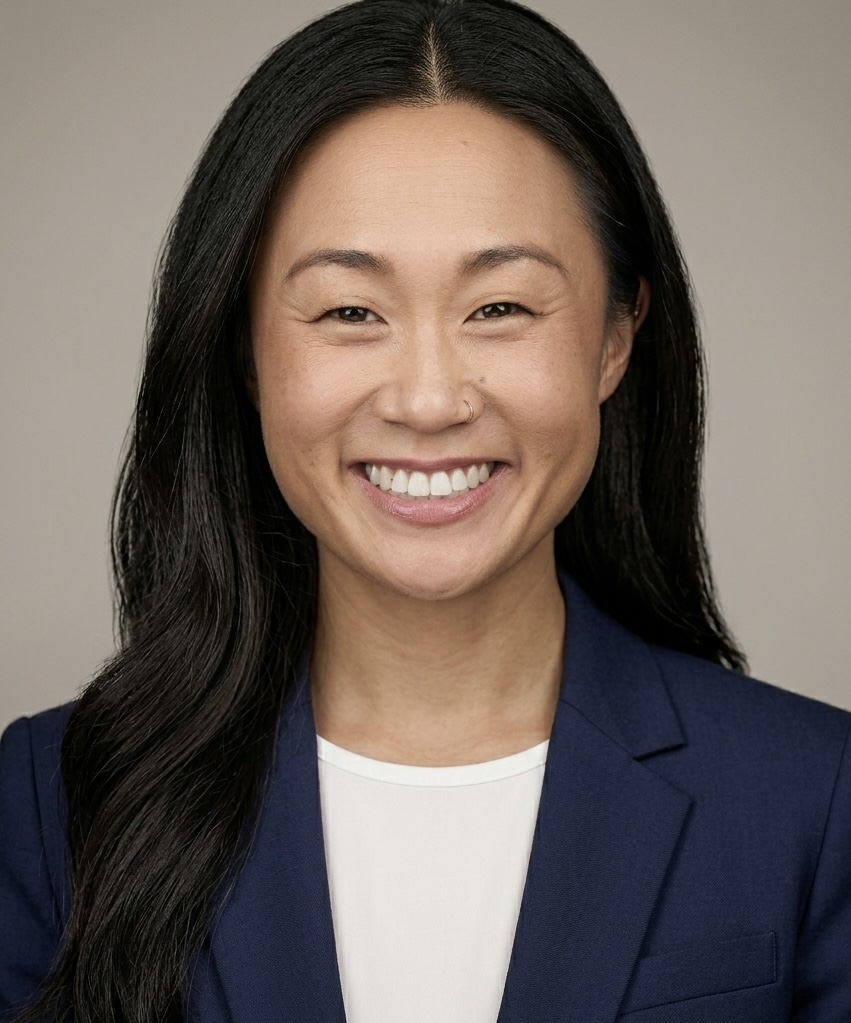 Chloe Edwards, smiling, wearing a navy blue blazer
